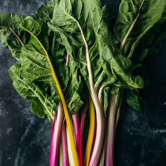 Five Colours chard with red, yellow, orange, and white stems.